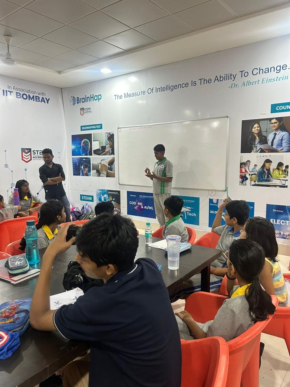 Students in a BrainHap branded robotics classroom session